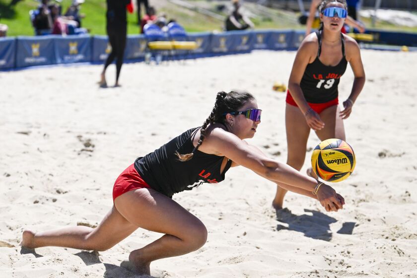 La Jolla High School's Lindasy Laumann dives as Paisley Mahn looks on during a set against La Costa Canyon during the CIF-San Diego Section beach volleyball division II finals held at Mesa College May, 6, 2023 in San Diego, Calif. (Photo by Denis Poroy)