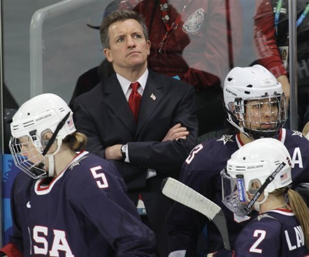 USA women's hockey head coach Mark Johnson watches his team play China in women's preliminary round hockey play at the Vancouver 2010 Olympics in Vancouver, British Columbia, Sunday, Feb. 14, 2010. (AP Photo/Chris O'Meara)