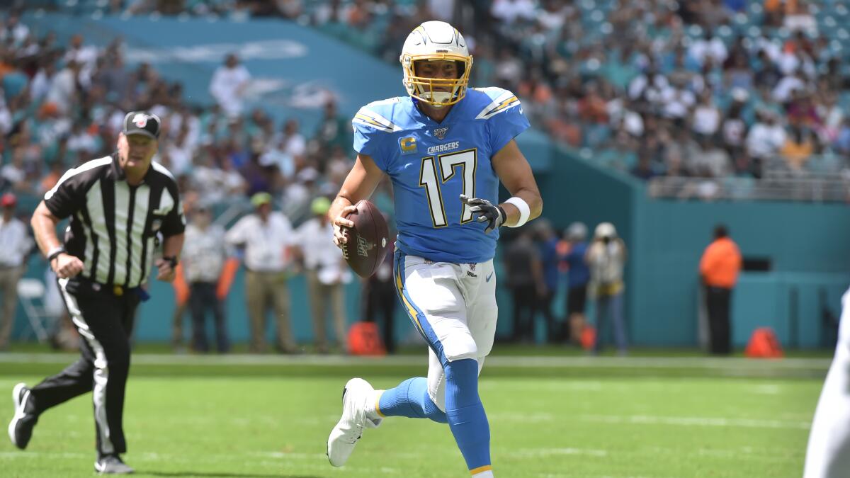 Los Angeles Chargers fullback Derek Watt (34) reacts in the end zone with  running back Melvin Gordon III (25) after Gordon ran for a touchdown during  an NFL football game against the