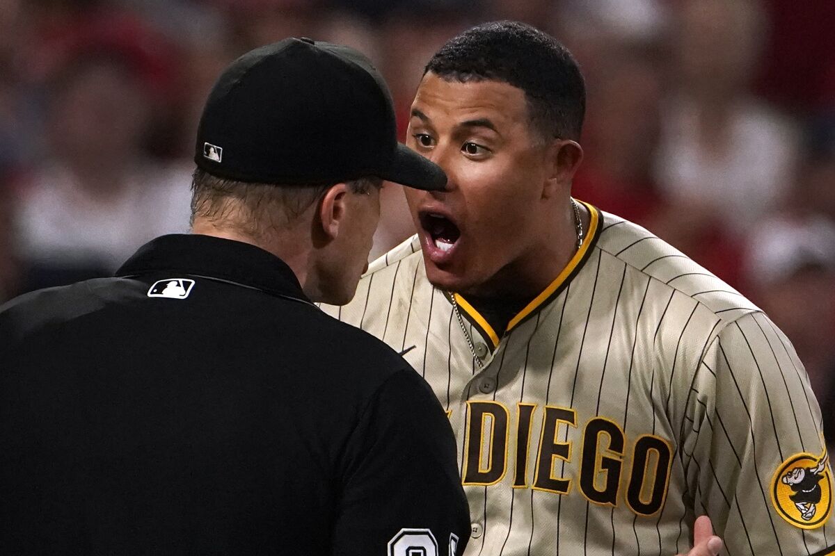 The Padres' Manny Machado argues after being ejected by home plate umpire Chris Segal