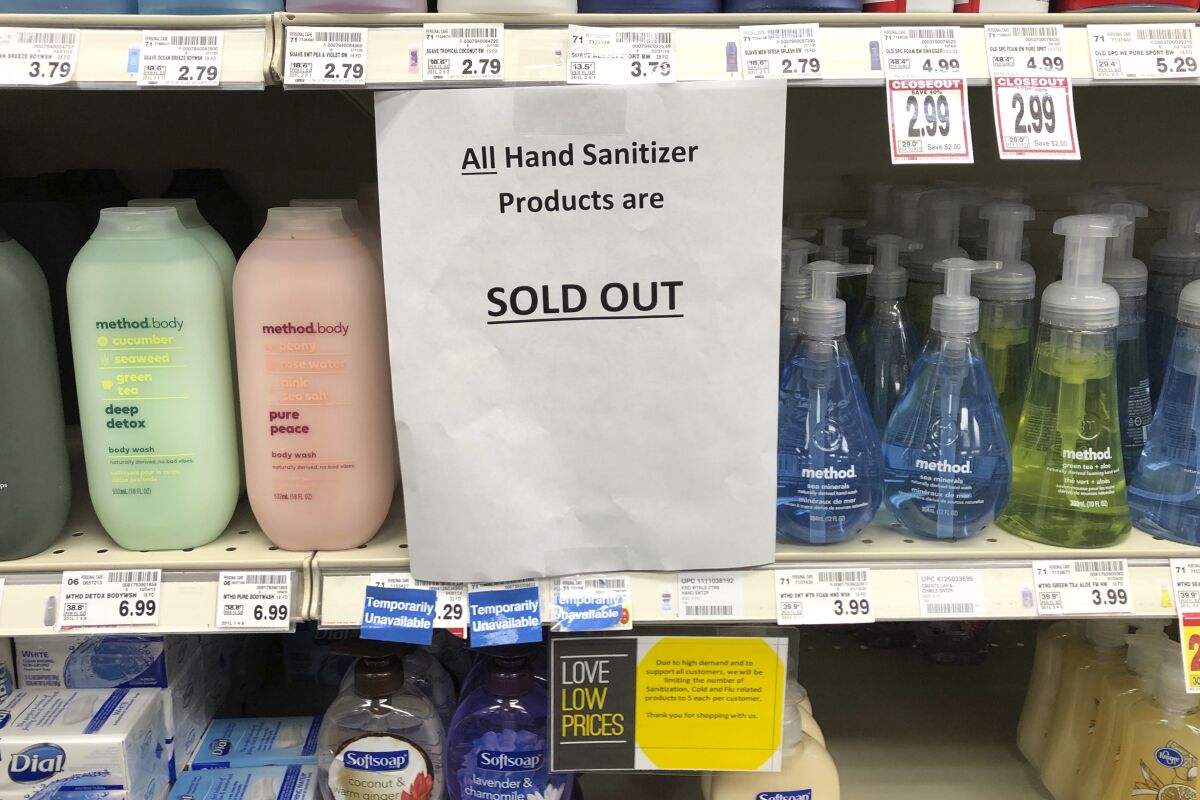 A  grocery store in Kirkland, Wash. advises shoppers hand sanitizer products are sold out. 