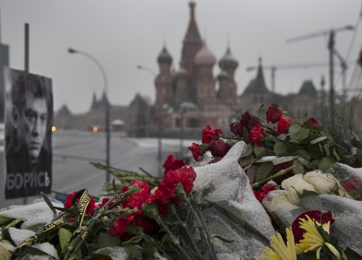 Flowers and a portrait of slain Russian opposition leader Boris Nemtsov mark the spot on a bridge near the Kremlin where he was gunned down on Feb. 27.