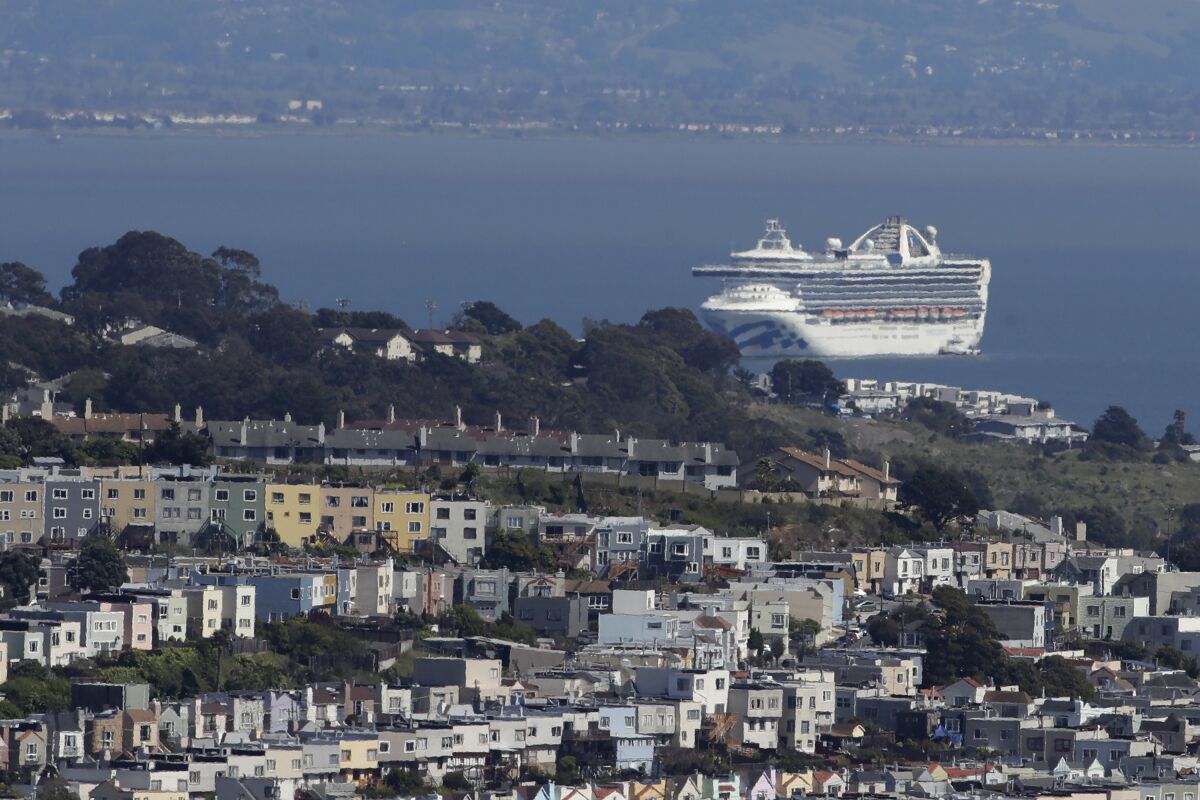 FILE - In this March 31, 2020, file photo, the Grand Princess cruise ship, carrying crew and passengers struck with the coronavirus, is shown in San Francisco. Cruise ships are returning to San Francisco after a 19-month hiatus brought on by the pandemic in what's sure to be a boost to the city's economy, the mayor announced Friday, Oct. 8, 2021. (AP Photo/Jeff Chiu, File)