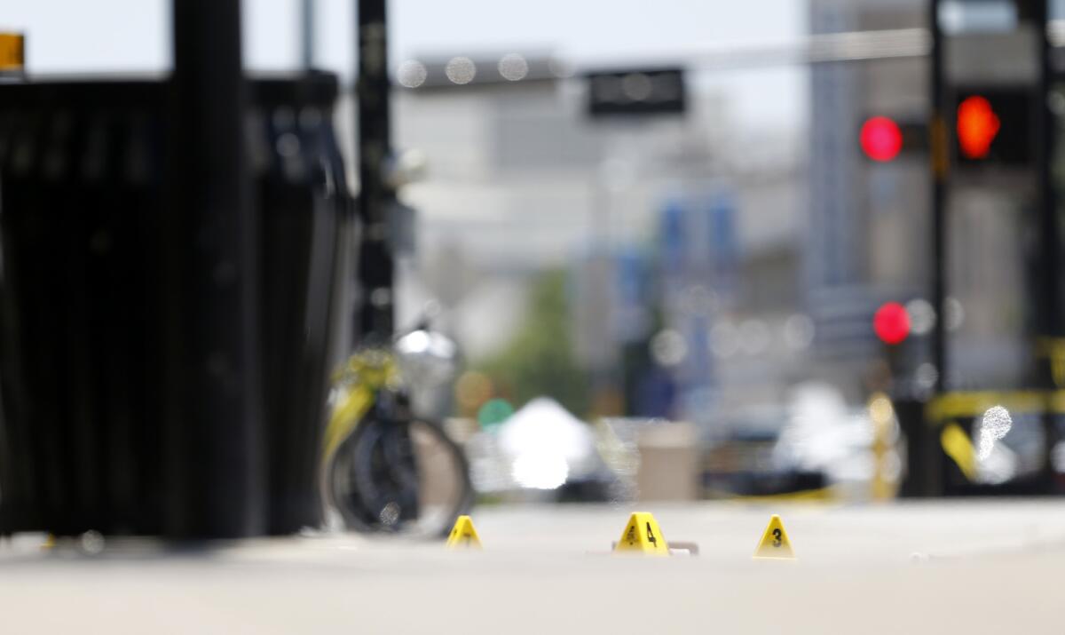 Evidence markers are seen in a plaza at the area of the attack on Dallas police officers Friday night.