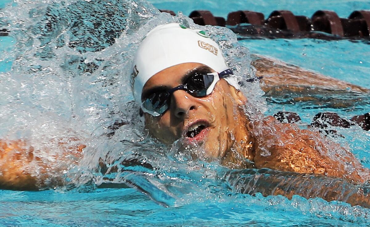 Costa Mesa's Luke De La Jara competes in the boys' 200 freestyle during the Division 2 finals at Mt. San Antonio College.