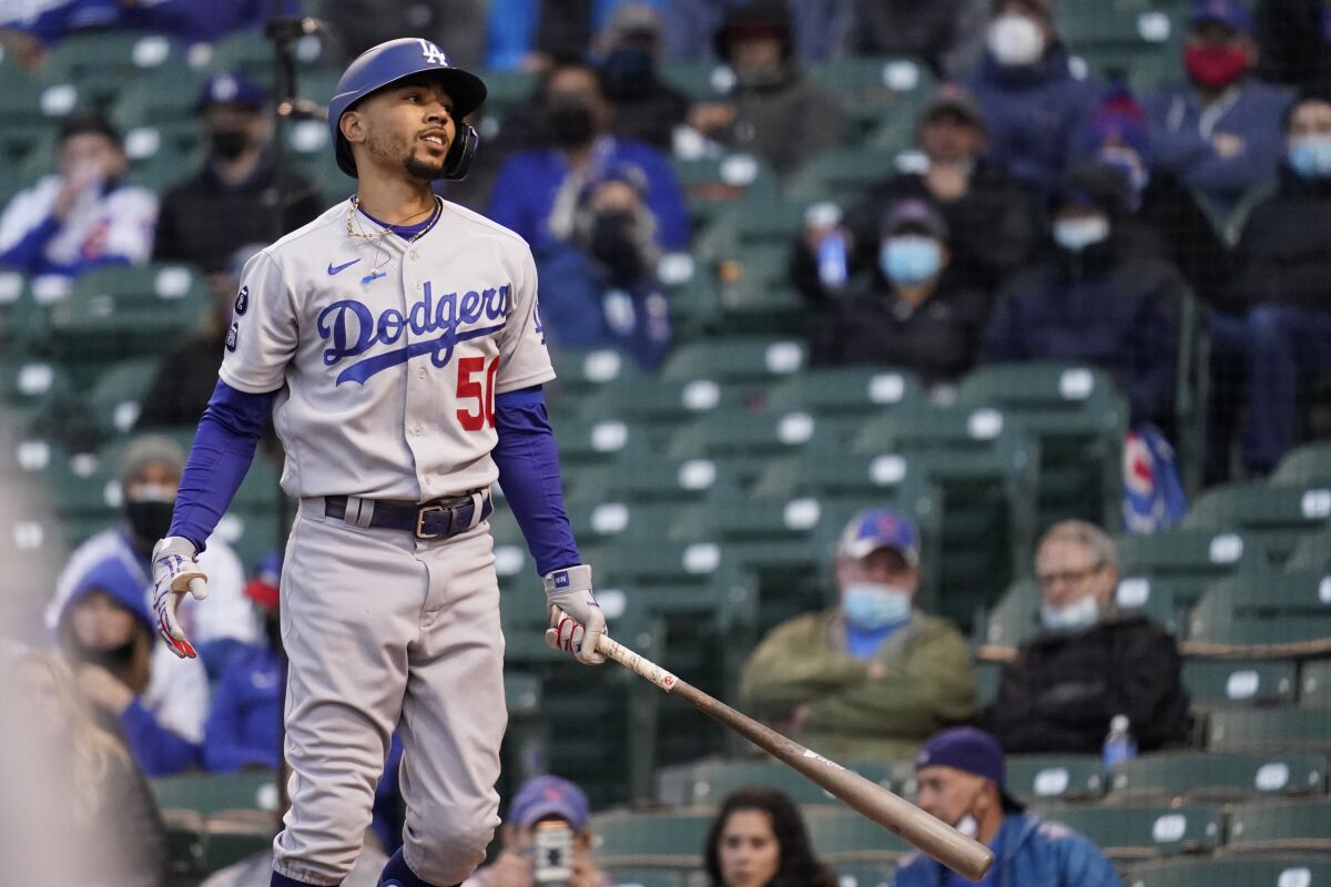 Dodgers right fielder Mookie Betts reacts after swinging at a pitch against the Cubs on Wednesday.