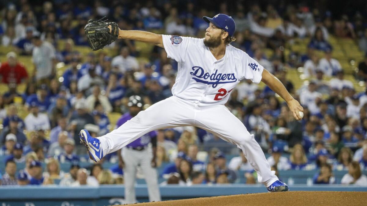 Dodgers starter Clayton Kershaw delivers a second inning pitch against the Colorado Rockies at Dodger Stadium on Tuesday.