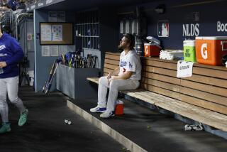 Los Angeles, CA - October 07: Clayton Kershaw sits in the dugout after being pulled.