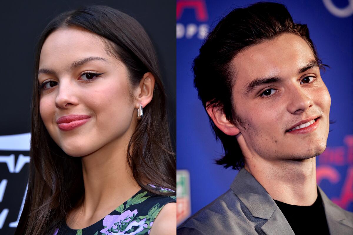 A split image of Olivia Rodrigo smiling with winged eyeliner and Louis Partridge also smiling at the camera.