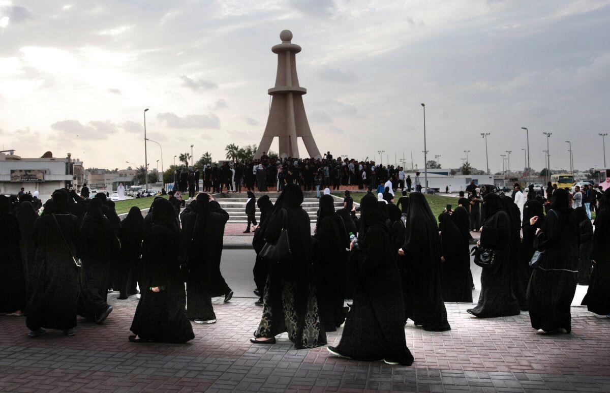 Saudi Shiite women (front) and men (back) take part in a Jan. 2, 2016, protest in the eastern coastal city of Qatif, Saudi Arabia, against the execution of prominent Shiite Muslim cleric Nimr al-Nimr.