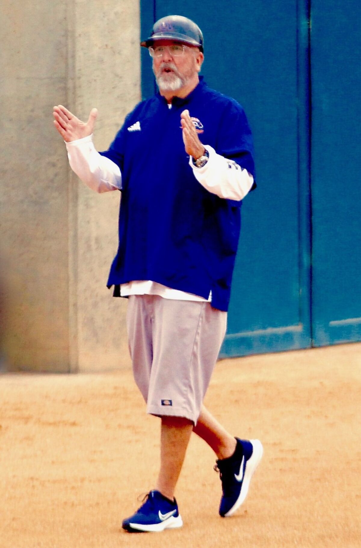 Coach Mike Smith of Eastvale Roosevelt High gives instruction to a player.