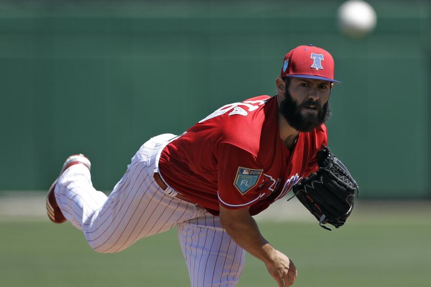 Phillies starting pitcher Jake Arrieta warms up before a spring training game against the Tigers on March 22, 2018, in Clearwater, Fla.