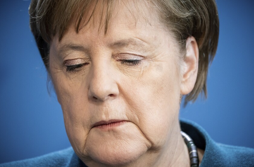 German Chancellor Angela Merkel speaks at a news conference in Berlin on Sunday about the coronavirus.
