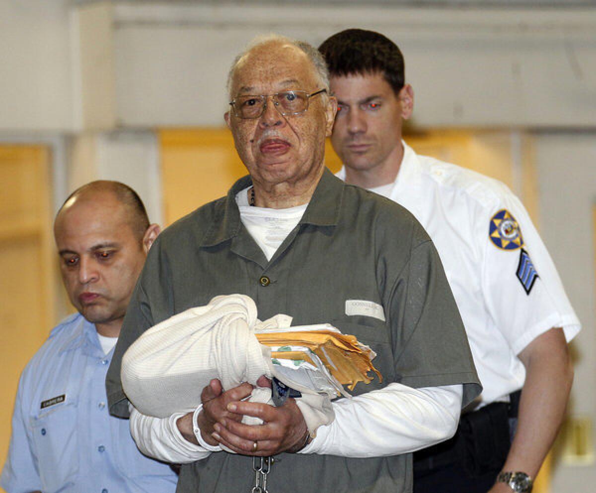 Dr. Kermit Gosnell is escorted to a police van upon leaving the Criminal Justice Center in Philadelphia after being convicted.