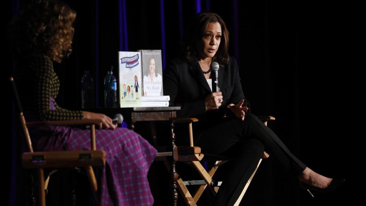 Sen. Kamala Harris of California talks with author Cleo Wade about the senator's new memoir, "The Truths We Hold," at the Wilshire Ebell Theatre in Los Angeles.