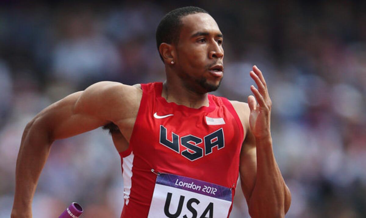 U.S. sprinter Bryshon Nellum competes in the men's 4 x 400-meter relay heat at the London Olympics.