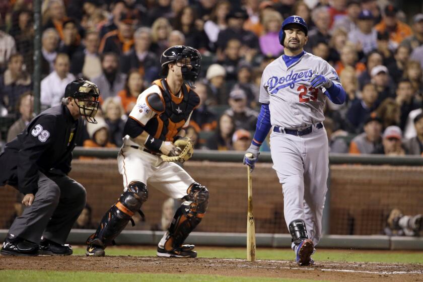 Dodgers first baseman Adrian Gonzalez reacts after striking out during the third inning.