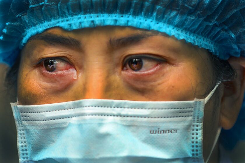 CHINA: Tears run out of the eyes of a nurse when she talks about the situation in Jinyintan Hospital, designated for critical COVID-19 patients, in Wuhan in central China's Hubei province.