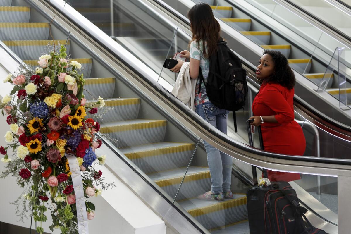 Flowers mark the terminal area where Gerardo Hernandez, a TSA employee, was killed during last November's shooting at Los Angeles International Airport. An airport security bill named in his honor is now proceeding through Congress.