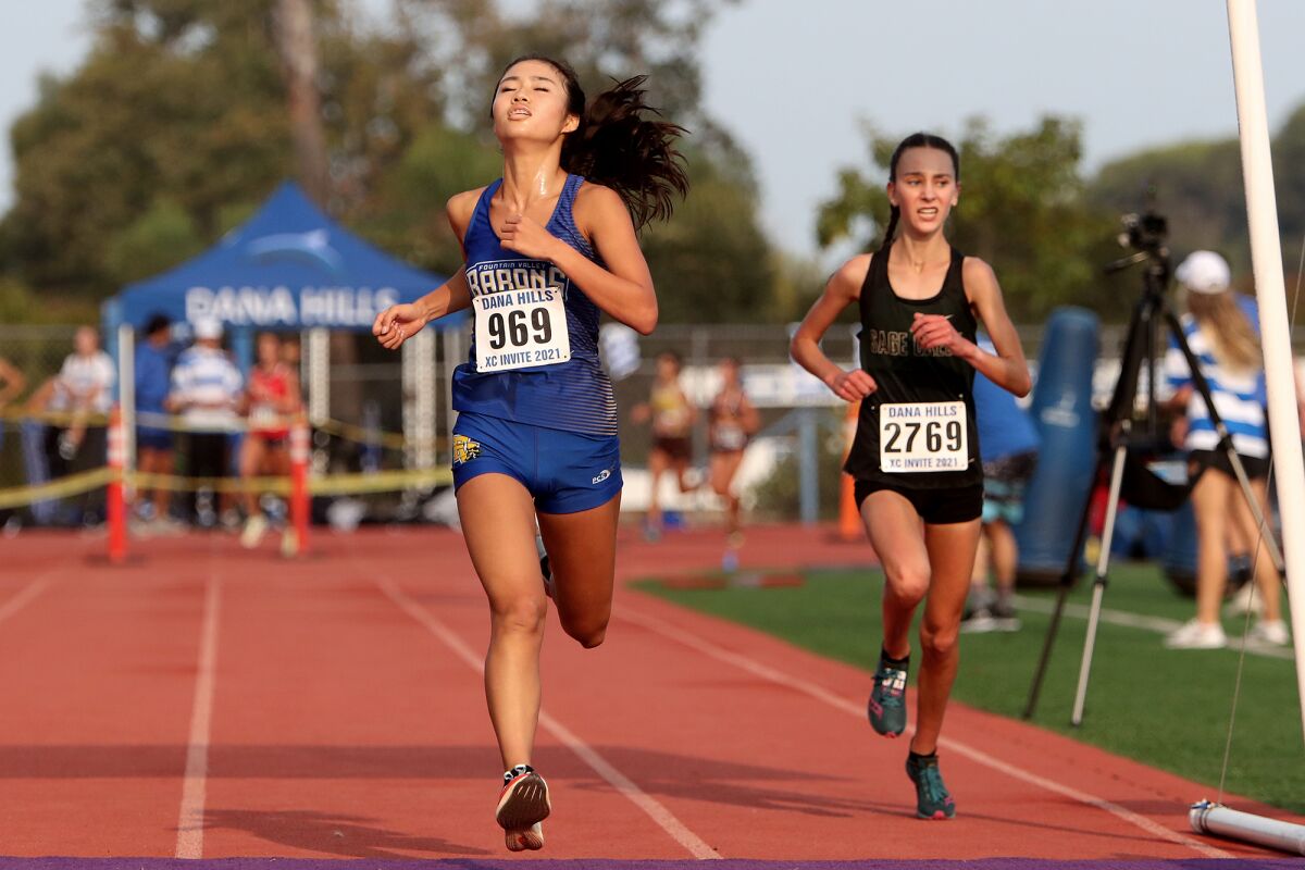 Fountain Valley senior Kaho Cichon (969) crosses the finish line third in the Dana Hills Invitational on Sept. 25.