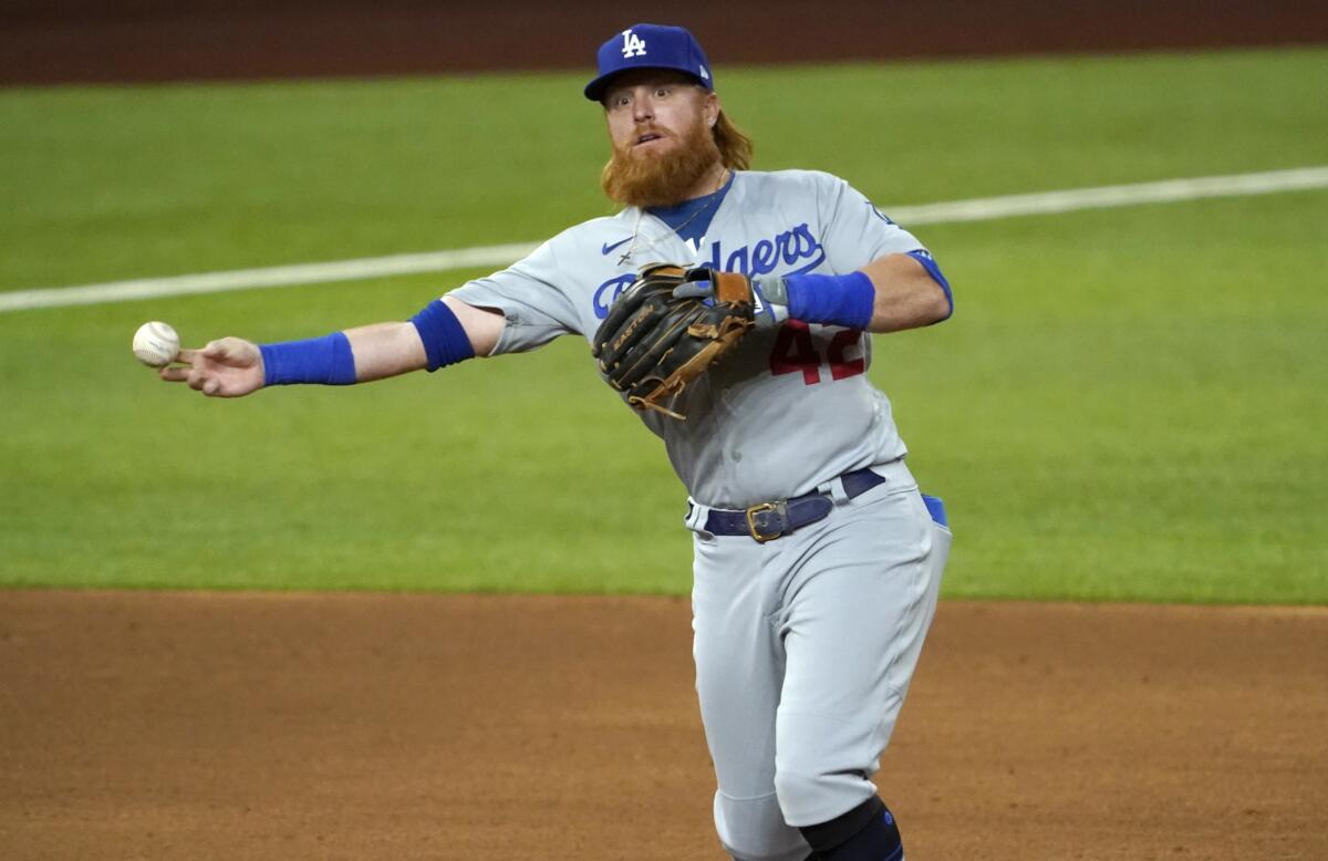 Los Angeles Dodgers third baseman Justin Turner throws to first for the out.