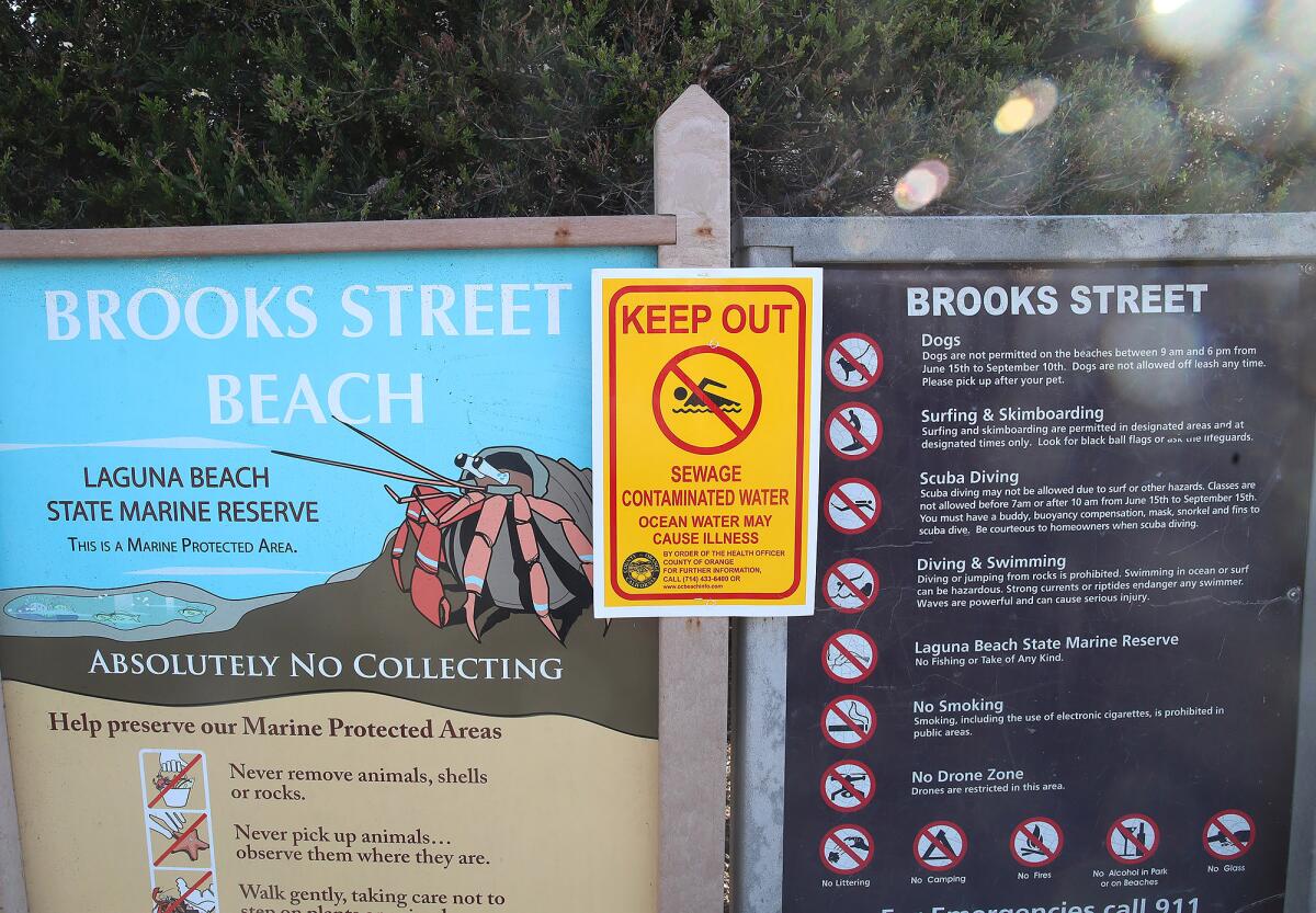 A sign warning beachgoers at the Brooks Street marquee.
