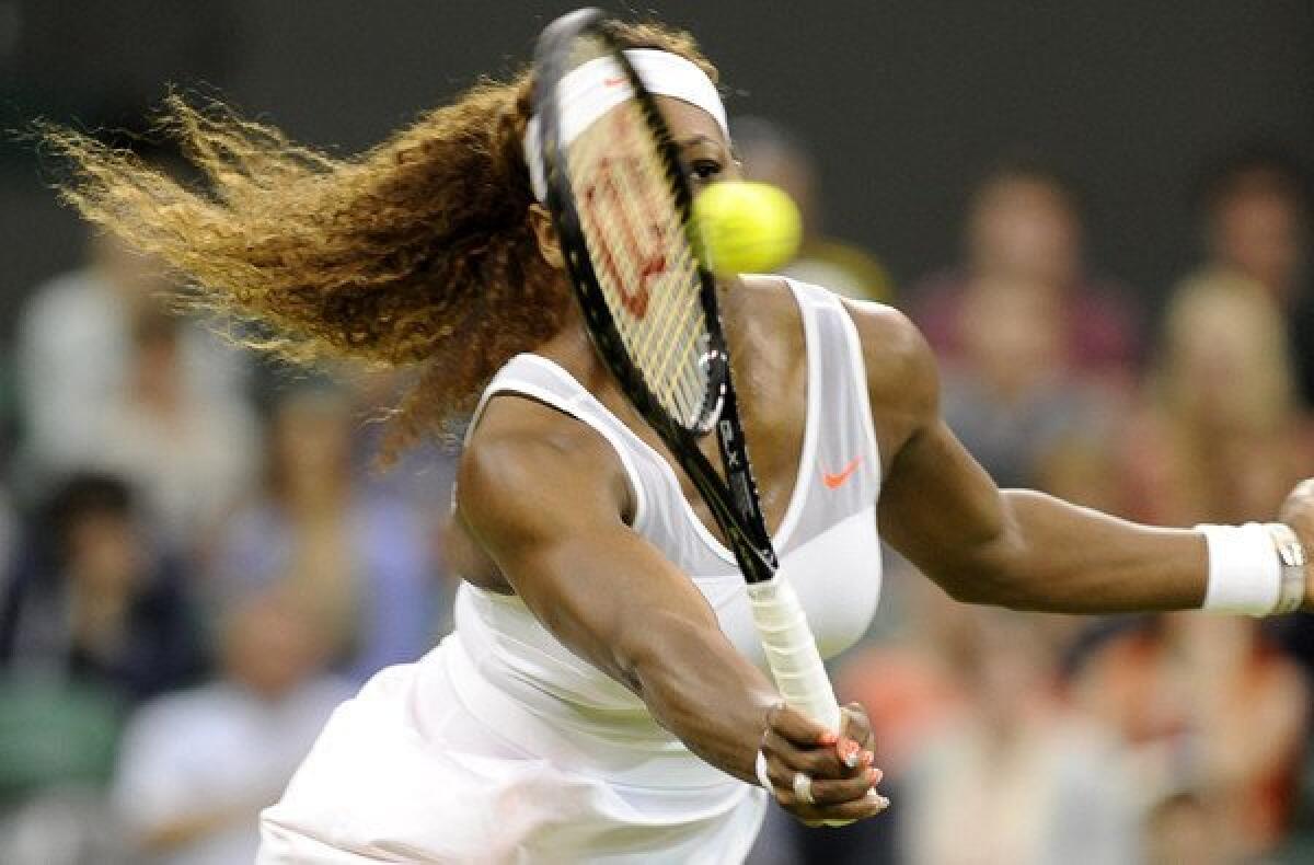 Serena Williams volleys a return against Kimiko Date-Krumm during their third-round match at Wimbledon on Saturday.
