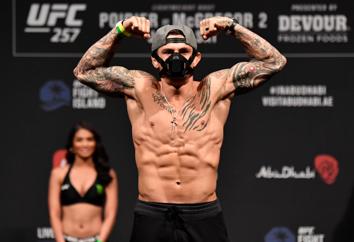 Dustin Poirier poses on the scale during the weigh-in for UFC 257 in Abu Dhabi on Friday.