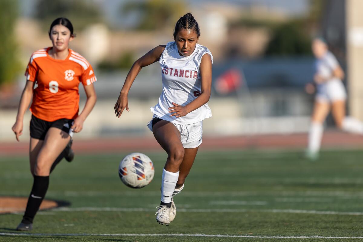 Estancia's Vanessa Pastrana (9) chases down the ball against San Jacinto in a CIF Division 5 semifinal on Saturday.