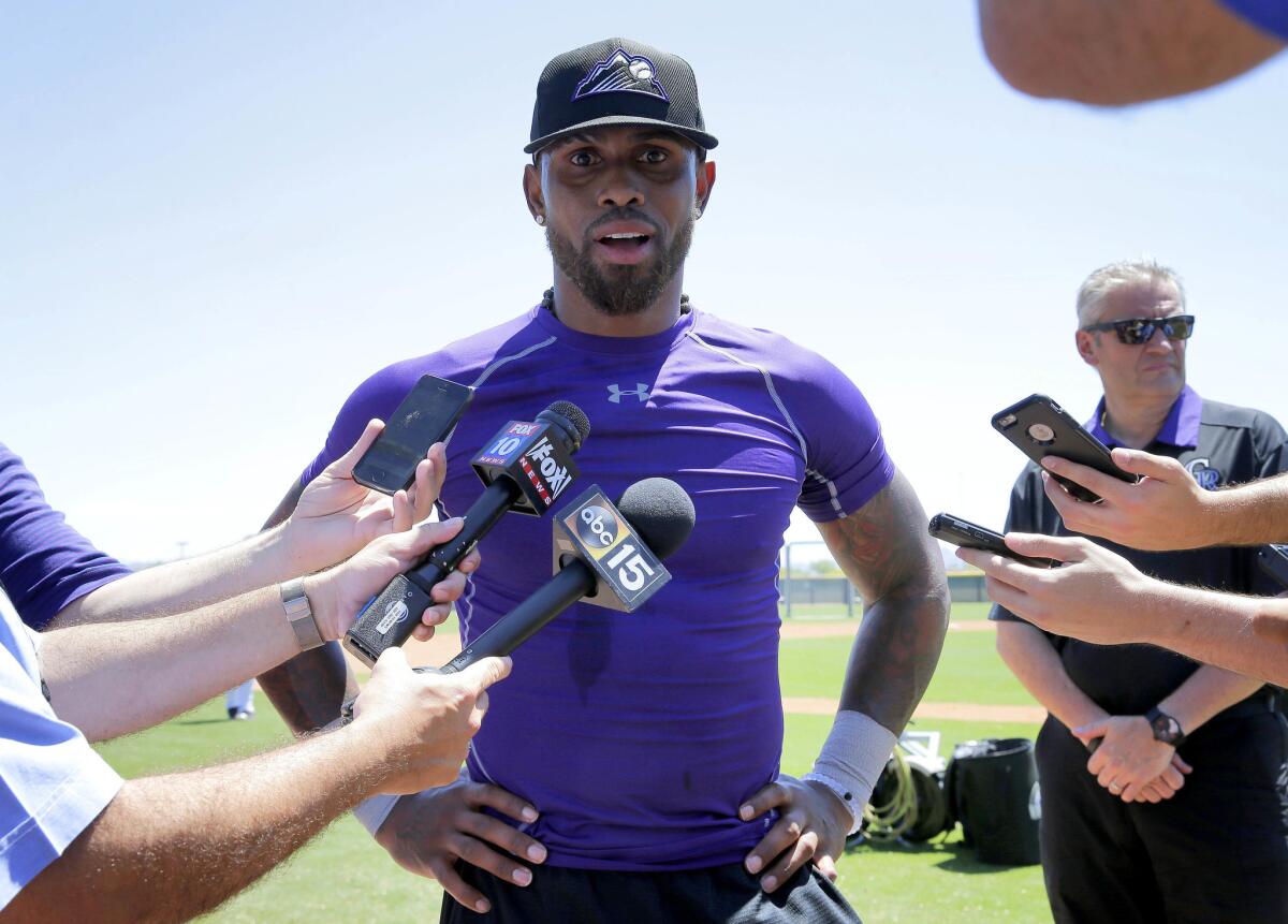 Rockies shortstop Jose Reyes talks with reporters after an extended spring training workout on May 19.