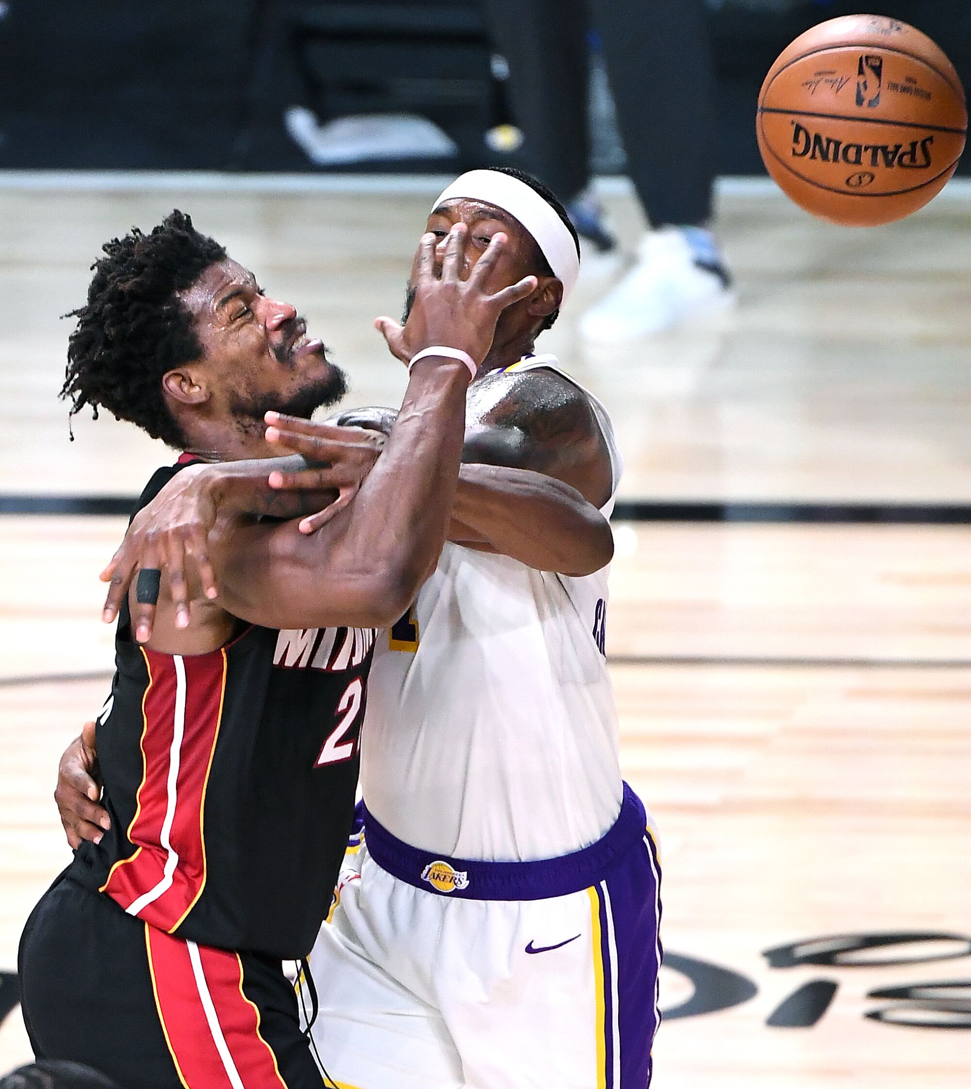 Lakers guard Kentavious Caldwell-Pope fouls Miami's Jimmy Butler as he drives to the basket in the fourth quarter of Game 3.