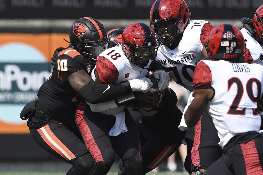 Oregon State linebacker Andrew Chatfield Jr. (10) sacks San Diego State quarterback Jalen Mayden (18) during the first half of an NCAA college football game Saturday, Sept. 16, 2023, in Corvallis, Ore. (AP Photo/Mark Ylen)