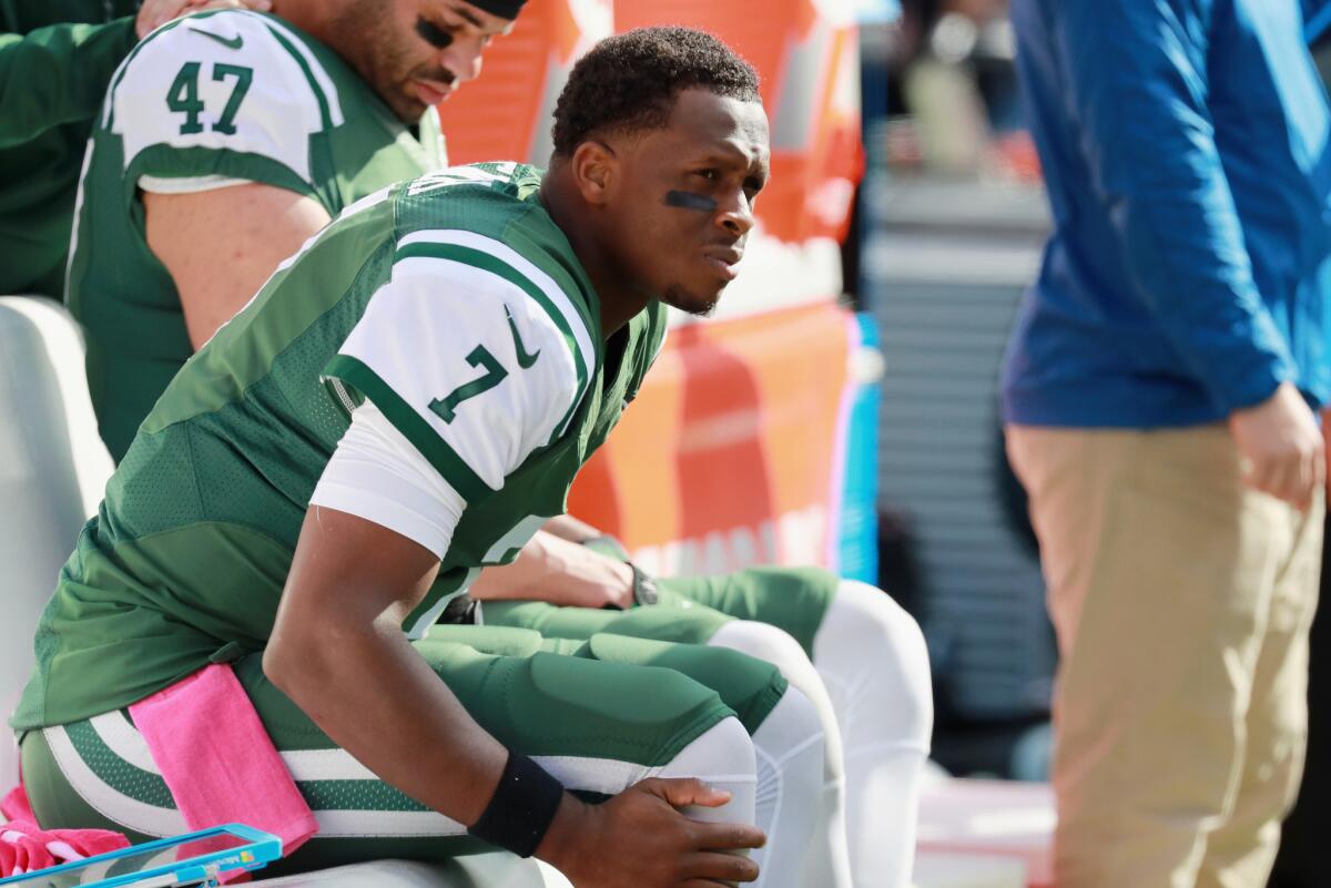 Jets quarterback Geno Smith (7) sits on the sidelines after being taken out of the game due to an injury during the second quarter on Oct. 23.