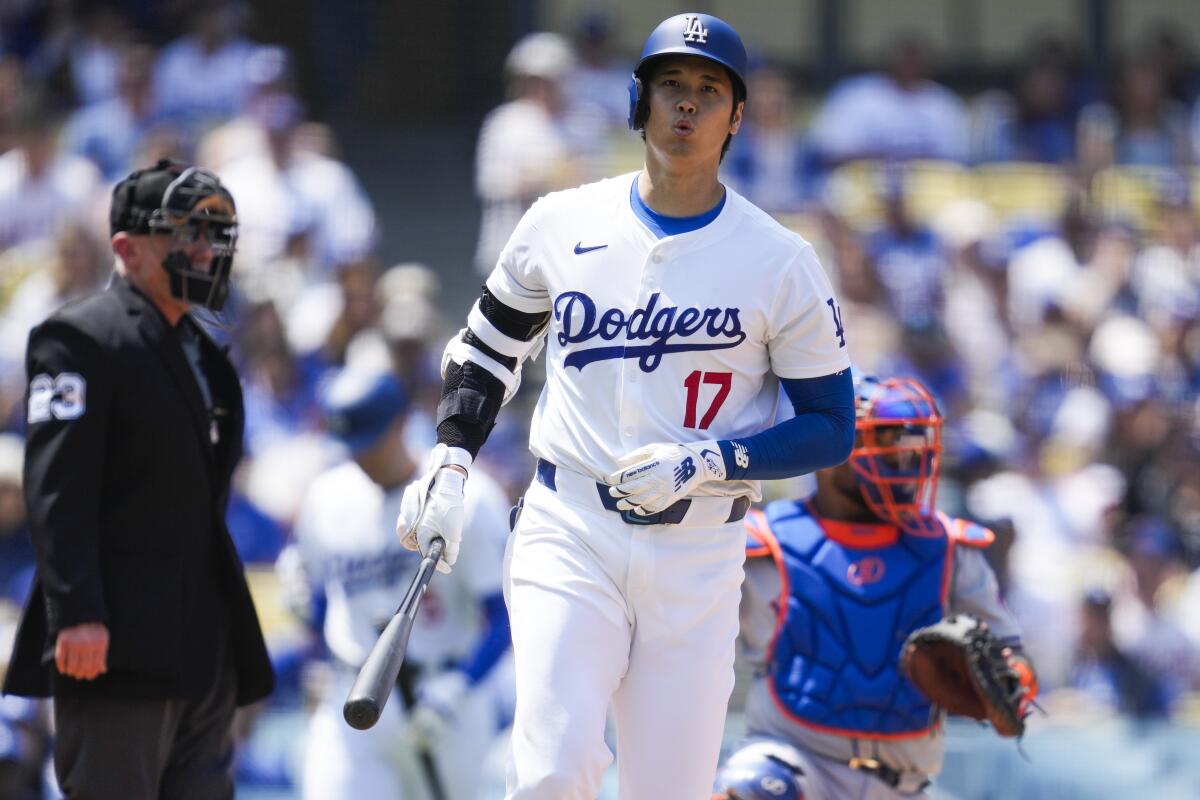 Dodgers star Shohei Ohtani reacts to a pitch inside during the second inning against the New York Mets.