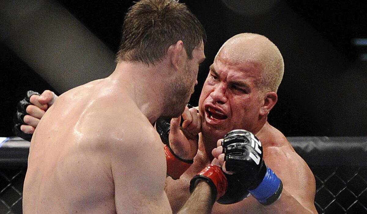 Tito Ortiz, right, and Forrest Griffin battle during UFC 148 in 2012. The 41-year-old Ortiz is fighting again on Saturday.