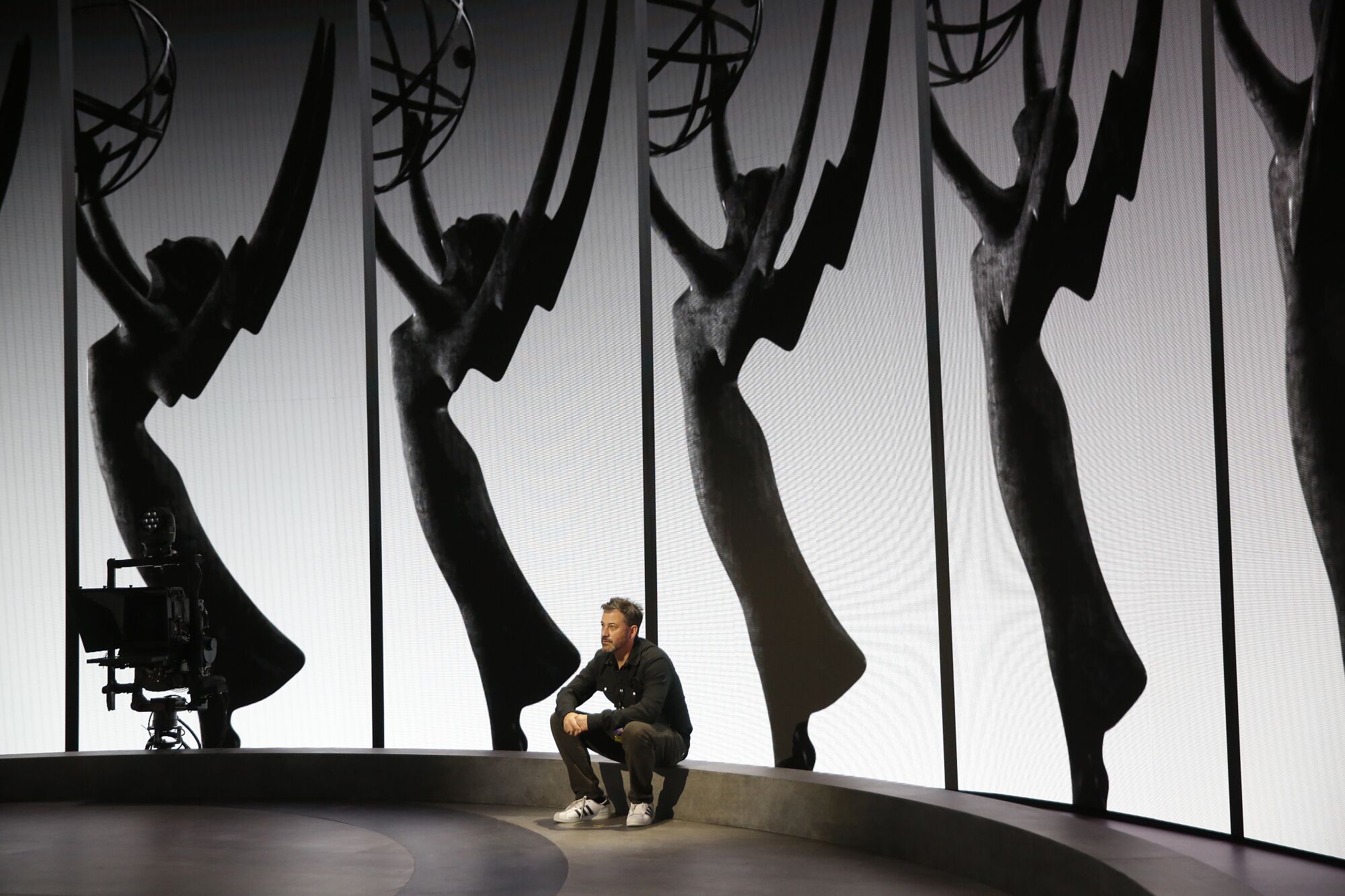  Emmy Host Jimmy Kimmel relaxes on the Emmy Awards stage.