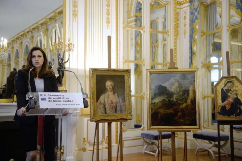 French Minister for Culture and Communication Aurelie Filippetti delivers a speech on Tuesday during a ceremony marking the return of three paintings confiscated by the Nazis.