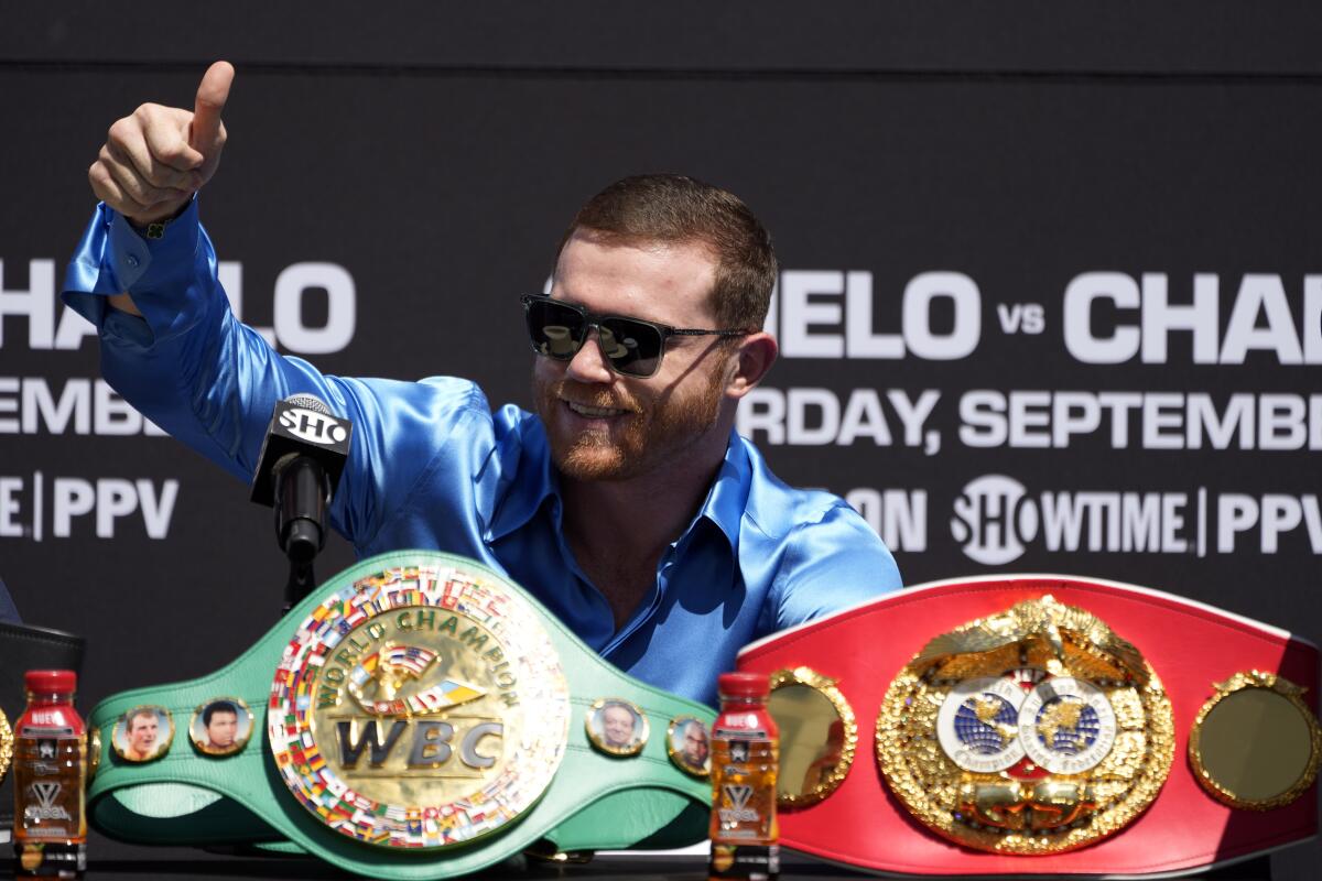 Undisputed super middleweight world champion Canelo Álvarez, of Mexico, greets the crowd.