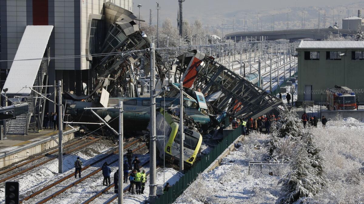 A high-speed train hit a railway engine and crashed into a pedestrian overpass at the station Dec. 13 in the Turkish capital, killing several people and injuring scores of others, officials and news reports said.