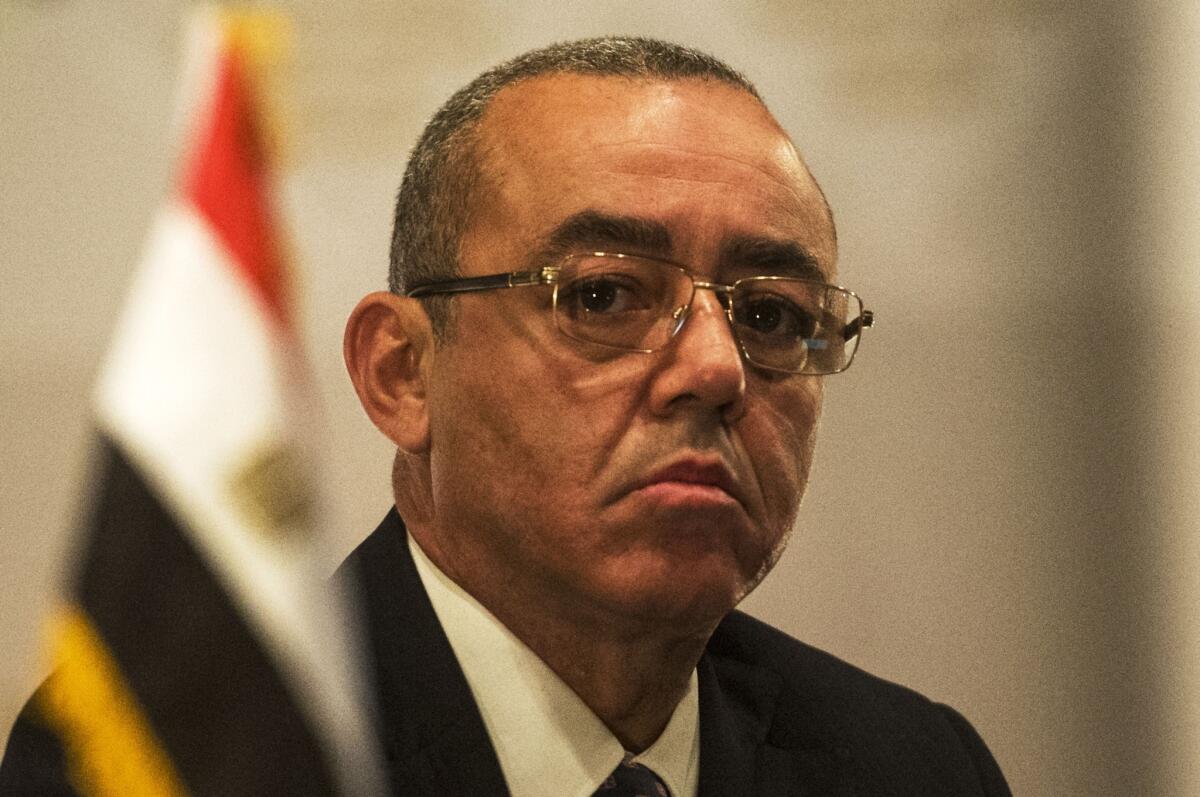 In Cairo, Egyptian Minister of Civil Aviation Hossam Kamal attends a Dec. 22 news conference on airport security.