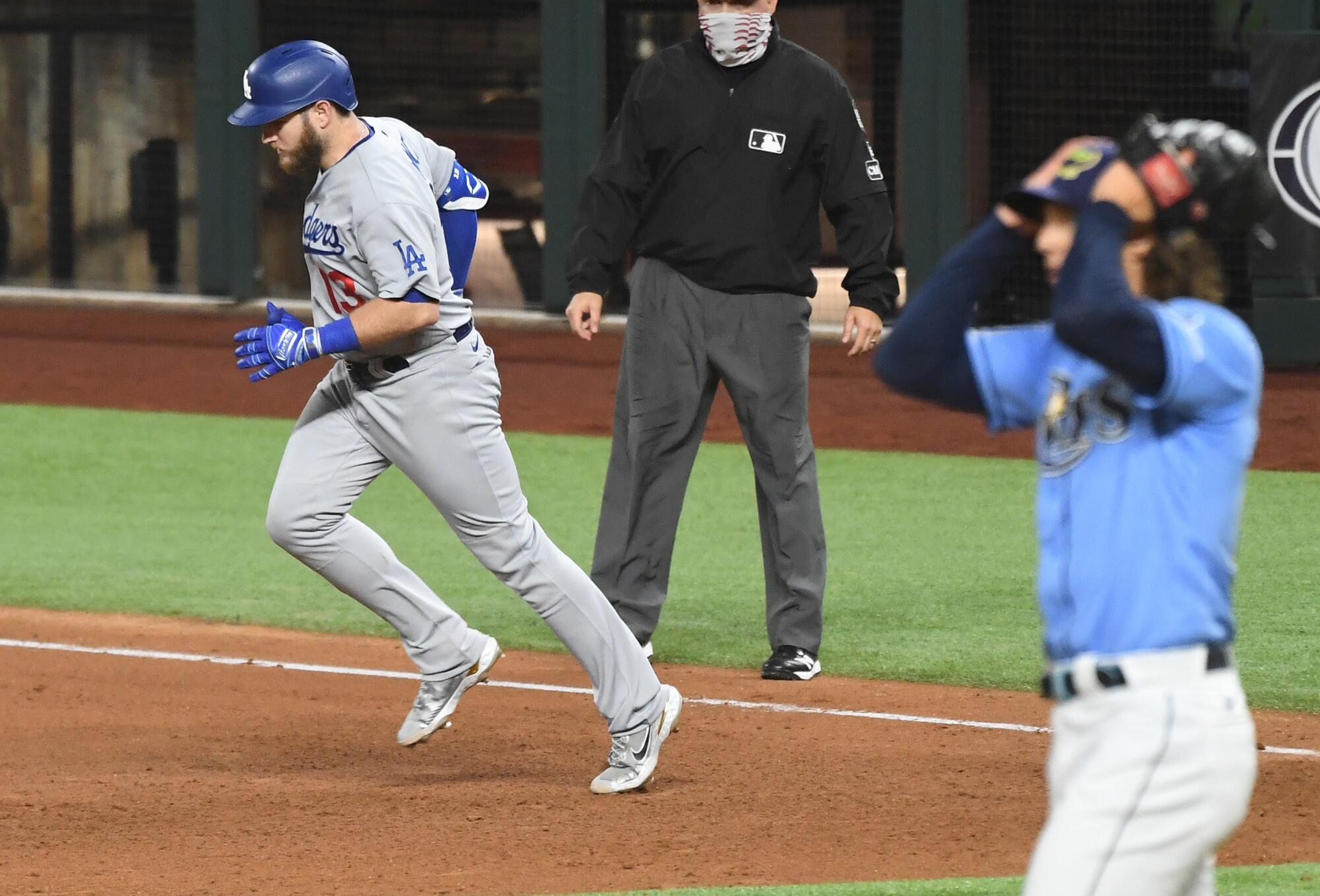Max Muncy rounds the bases after his fifth-inning solo home run off Rays pitcher Tyler Glasnow.