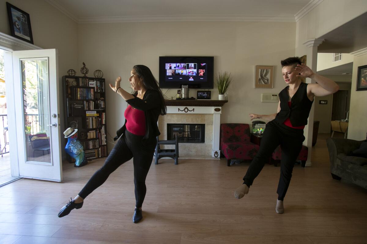 Dance instructor Arlene Santos, left, with student Amy Rubinstein.