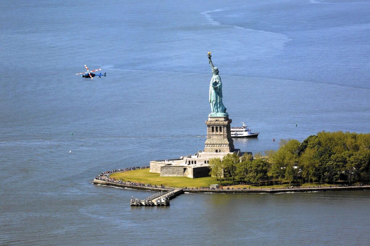 Getting to this view of the Statue of Liberty from One World Observatory may be cheaper than in past years: New York hotel prices have dropped, Travelzoo reports.