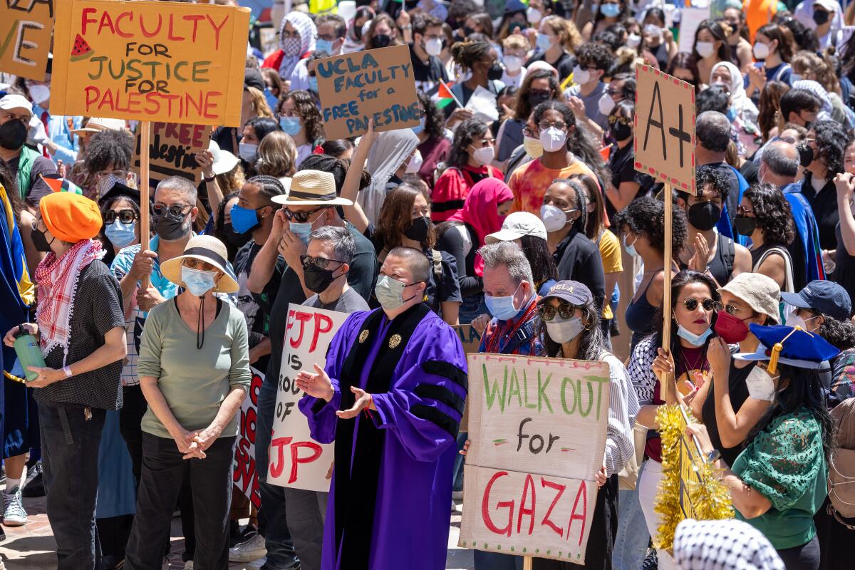 Pro-Palestinian demonstrators hold a student- faculty rally at Dickson Plaza 