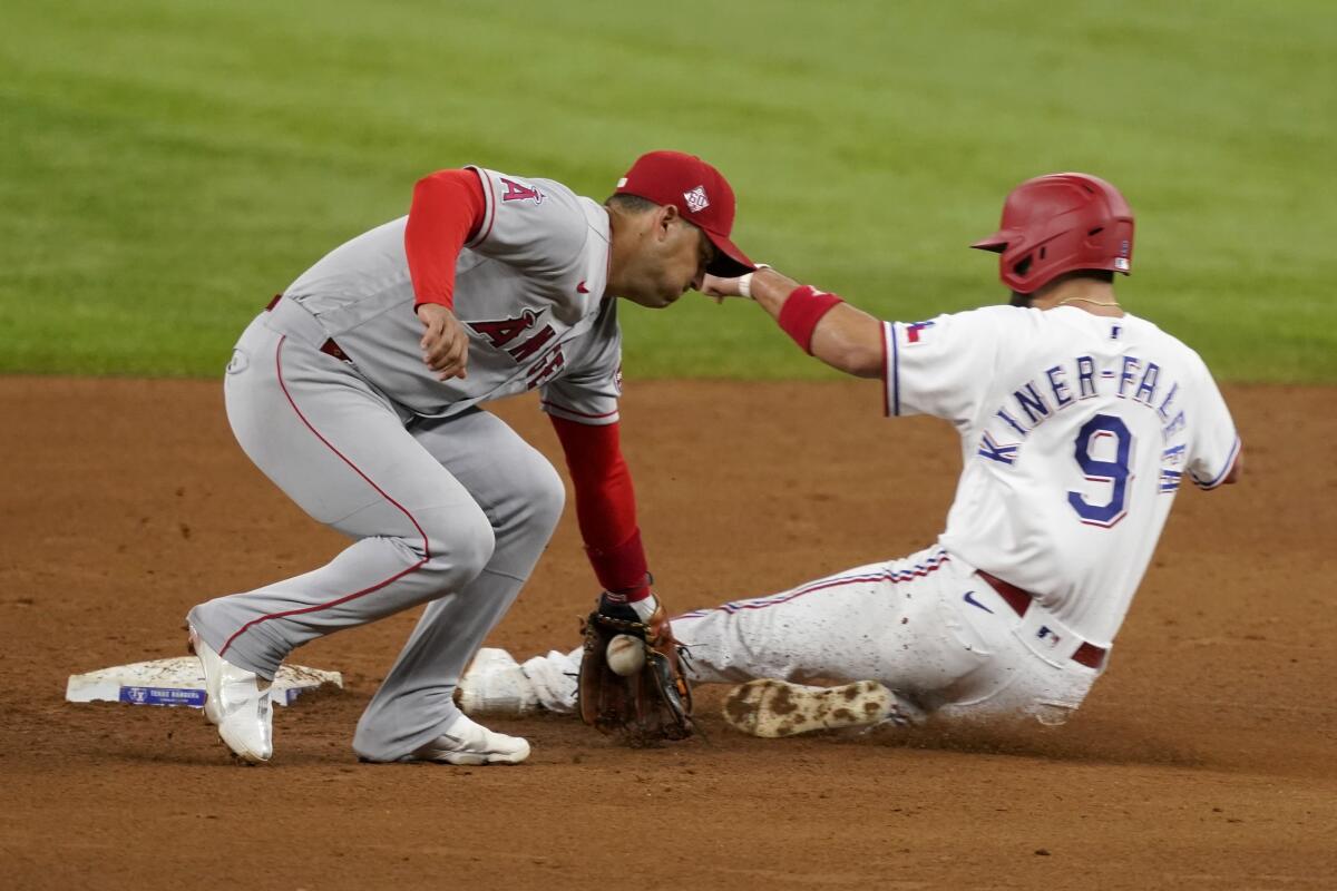 Angels shortstop José Iglesias catches a throw as the Texas Rangers' Isiah Kiner-Falefa steals second base.