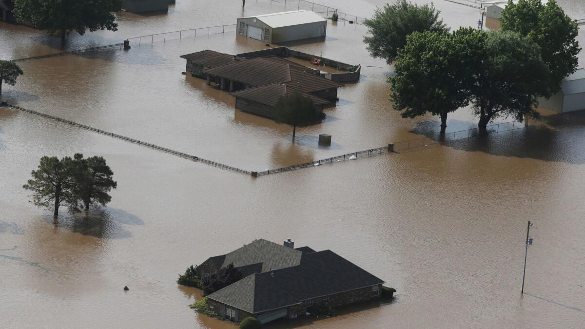 Flooded homes on the Arkansas River in Tulsa, Okla., on Friday.