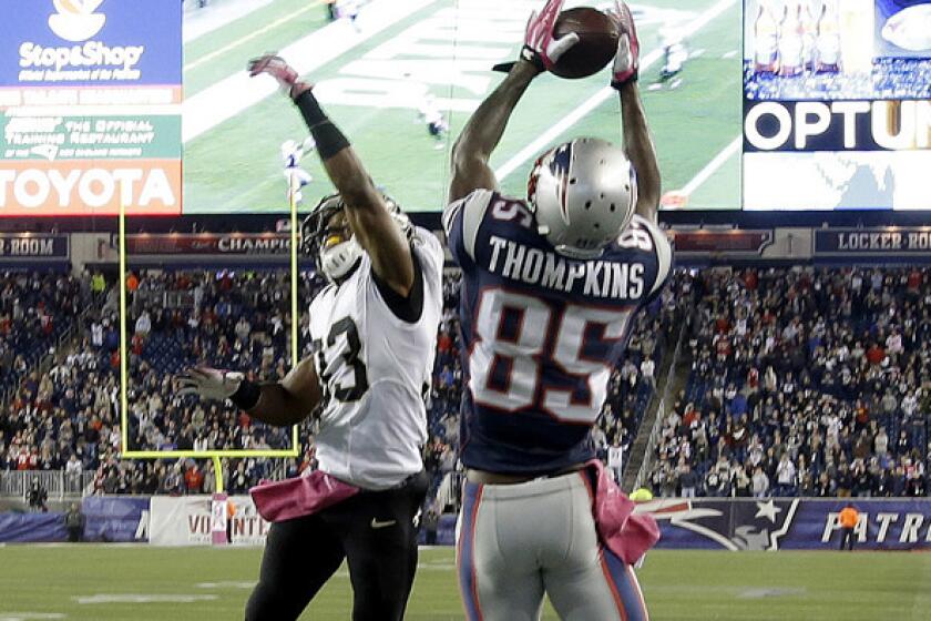 Patriots wide receiver Kenbrell Thompkins catches the winning touchdown pass against Saints cornerback Jabari Greer (33) with five second left in the fourth quarter Sunday.