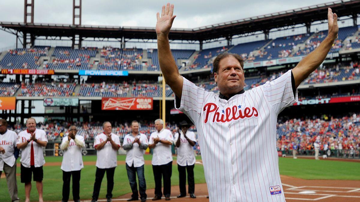Former Phillies catcher Darren Daulton waves to the crowd as he takes the field during the Philadelphia Phillies Alumni ceremonies before a game on Aug. 3, 2013. Daulton passed away Sunday.