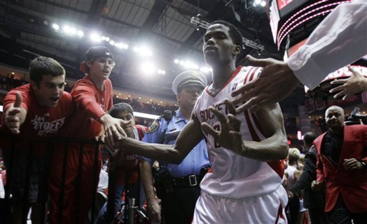 Houston Rockets' Aaron Brooks runs off the court following Game 4 of a second-round Western Conference NBA playoff basketball series against the Los Angeles Lakers in Houston, Sunday, May 10, 2009. Houston won 99-87. (AP Photo/Eric Gay)