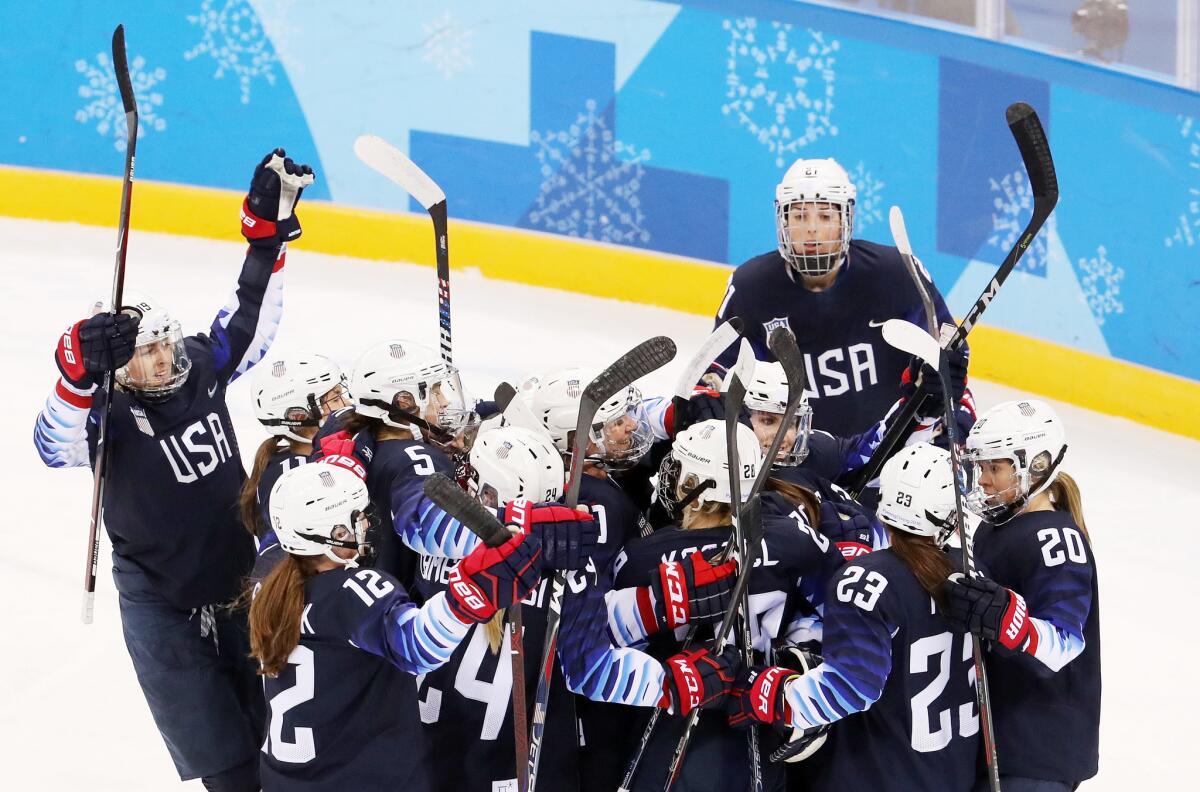 United States celebrates their 5-0 win over Finland.